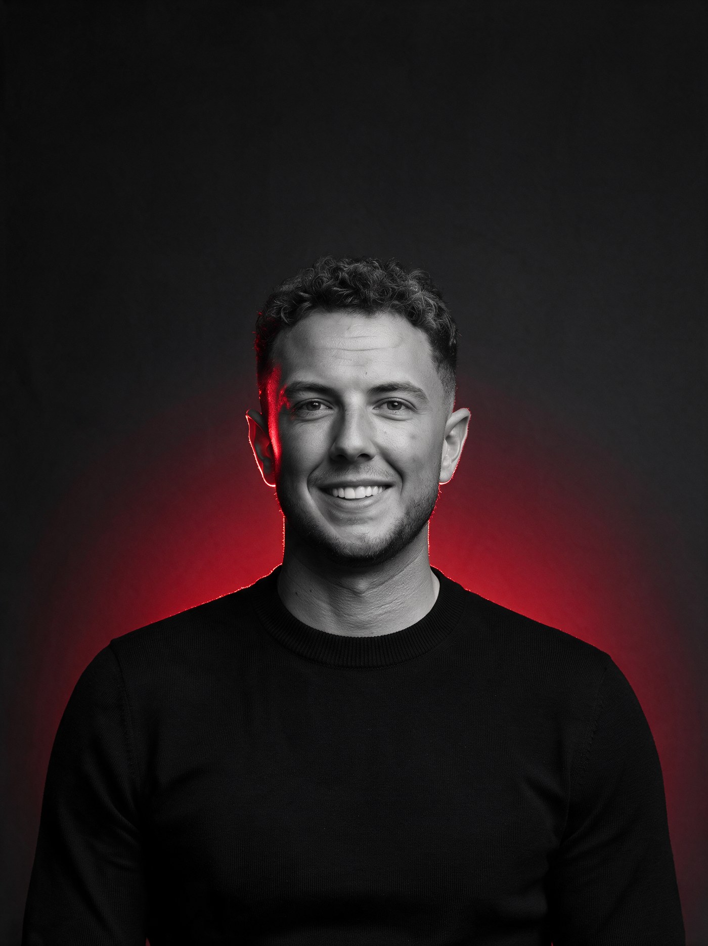 Tommy — founder of Ninja Leads, portrait with red glow